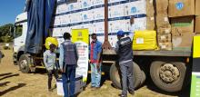 WHO Staff inspecting the donated items