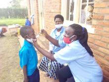 CHW providing deworming tablet