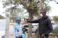 Mmoloki Malemane (right) checking a patient’s temperature before they enter the hospital as part of his Covid-19 pre-screening routine.