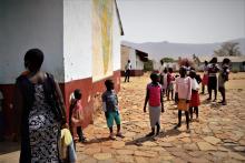 Children waiting to receive  deworming medicines (praziquantel and albendazole)