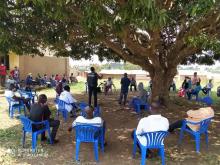 Ministry of Health and WHO officials conduct a training session for the Village Health Team members 