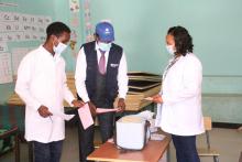 A WHO Ethiopia technical officer discussing with vaccinators during the HPV vaccine in January 2021