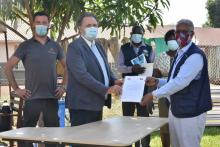 WHO Representative in Uganda Dr Yonas Tegegn Woldemariam (blue jacket) upon signing an agreement of cooperation with the  Dr. János Terényi, Head of Office, Office of the Embassy of Hungary in Nairobi