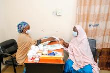 A trained psychiatric nurse attending to a mental health patient 