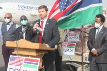 The Deputy Chief of Mission at the United States Embassy in the Gambia, Mr Jason Willis, handing over the vaccines to the Hon. Minister, Dr. Ahmadou Lamin Samateh