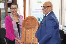 Honourable Minister of Health, Nassoro Mazrui handing over a token of appreciation to Dr. Tigest Mengestu during the farewell reception hosted in Zanzibar.