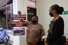 Ms. Mary Kessi, WHO Country Office Staff Association Chairperson handing over a souvenir as a token of appreciation to Dr. Tigest, on behalf of all staff. 