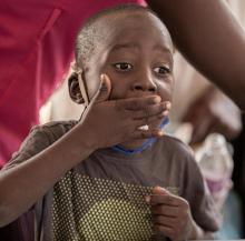 Child receiving her deworming medication during the campaign 