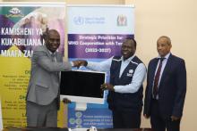 Acting WHO Country Representative, Dr. Zabulon Yoti handing over EOC equipment