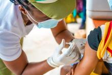 A man recieving the COVID-19 vaccine at the health centre.j