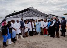 Health workers poses with Malawi President