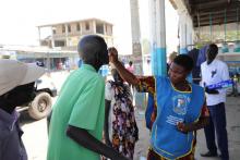 A health worker administers oral cholera vaccine