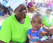 Community Health Workers demonstrating their work in the community on nutrition.