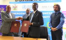 xecutive Director of MHSS, Mr Ben Nangombe and WHO Representative, Dr Charles Sagoe-Moses holding the signed the Memorandum of Agreement (MOA) for the SURGE and TASS Project 