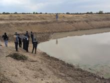 WHO and MoH at the water source in Onamine