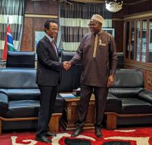 Dr. Desta Tiruneh (left) shakes hand with Vice President Muhammad B. S. Jallow (right)