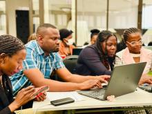 Participants deliberating during the Content Development Workshop