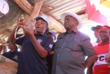 Hon. Dr Kalumbi Shangula, Minister of Health and Social Services with a  health worker at one of the health outreach points in Opuwo Health District 