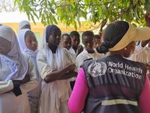 Dr. Jane Maina, WHO Country Representative, educates students on the significance of medication adherence in combating Schistosomiasis