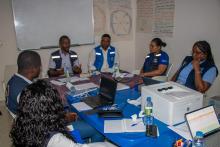 WHO, UNHCR and IEIA discussing health services in Lovua Settlement