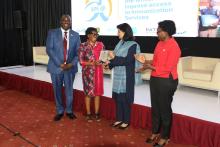 Dr Annet Kisakye receives her award