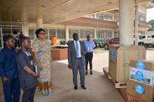 The Minister of Health, Dr Louise Mapleh Kpoto, receiving the EEG set from WHO Rep, Dr Clement Peter