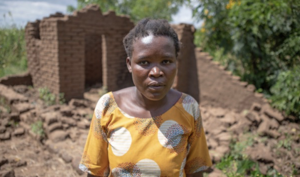 Eunice Sopo outside her destroyed home.