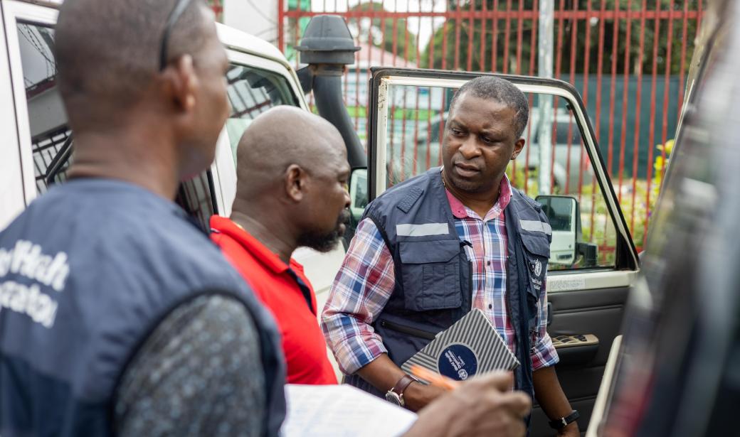 WHO operations team conducting a thorough vehicle inspection before deploying vehicles to the field to support the polio vaccination campaign, ensuring safe and efficient transportation for the mission ahead 