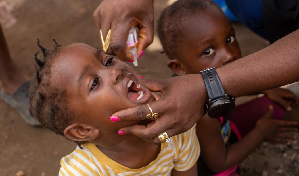 A child receiving the polio vaccine, symbolizing the hope for a polio-free Liberia and a polio free world.